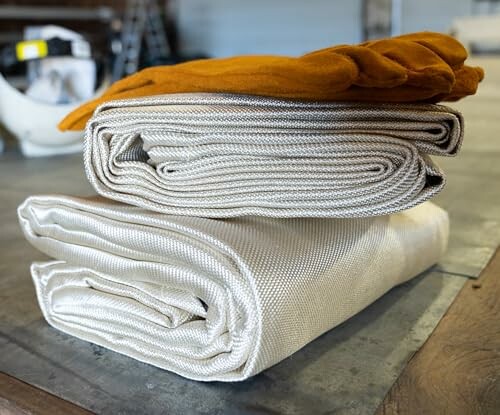 Folded fabric with gloves on a table