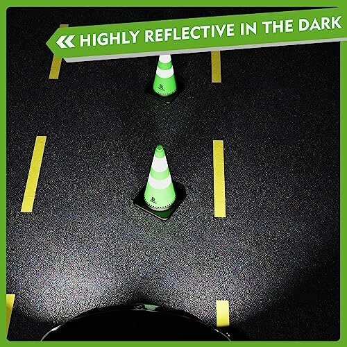 Reflective traffic cones on a dark road with highlighted text.